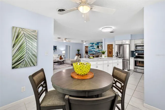 a dining room with furniture and window
