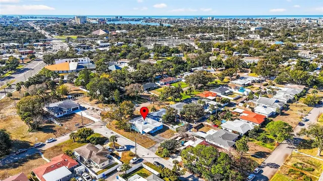 an aerial view of residential houses with city view