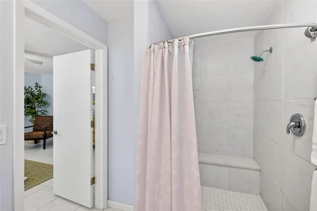 a bathroom with a shower and a tub