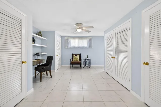 a view of a livingroom with lounge chair and a window