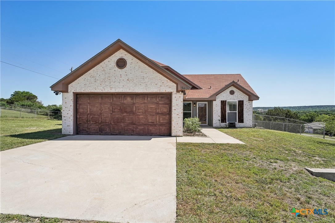a front view of a house with yard