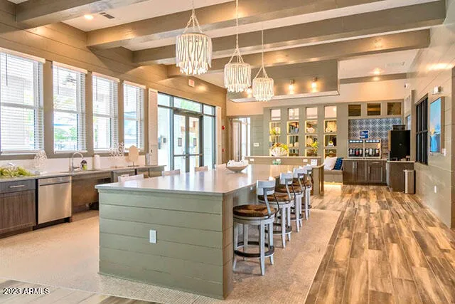 a large kitchen with a table and chairs