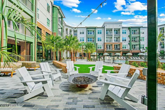 a view of an chairs and table in the patio