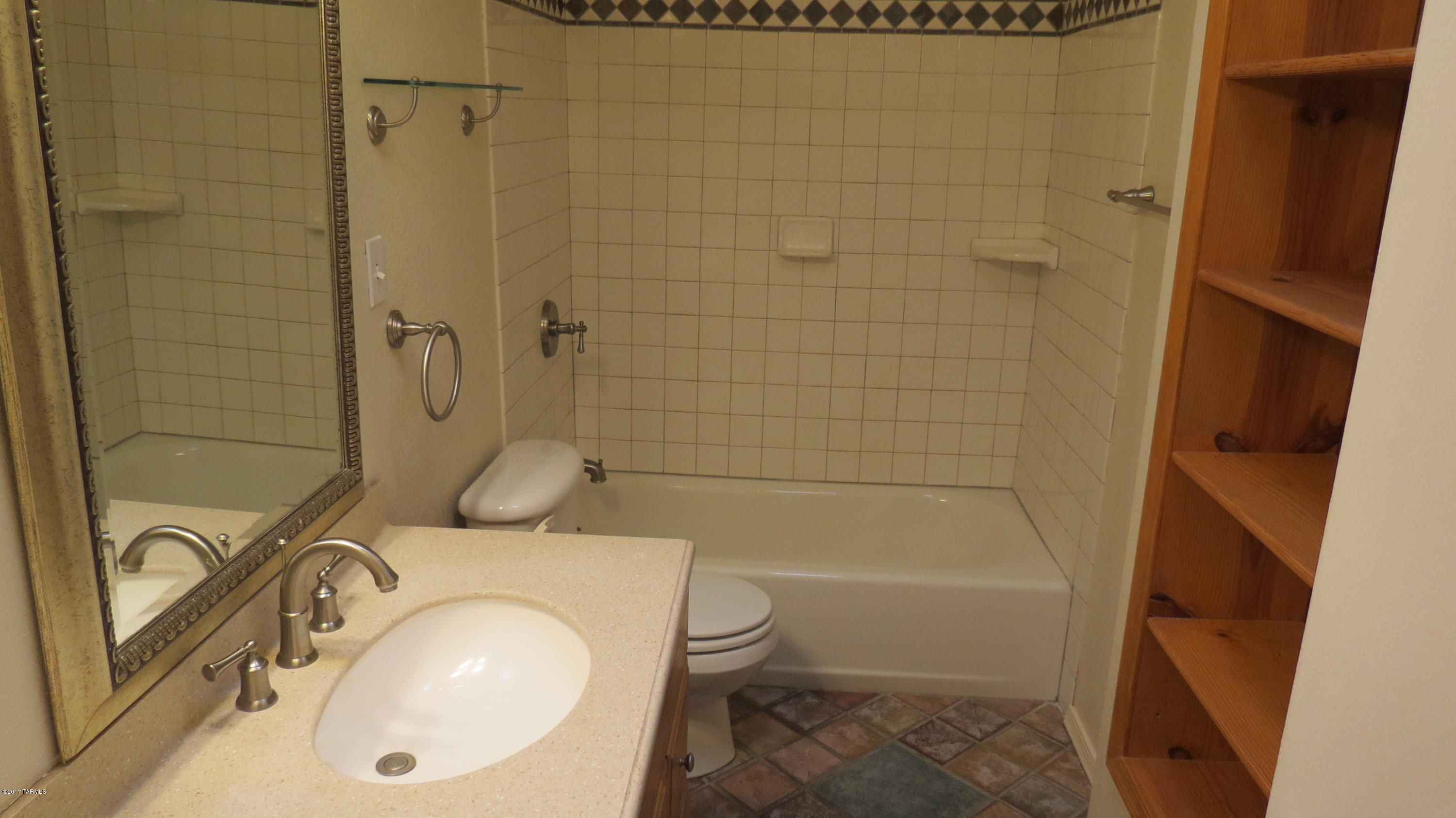 6601 North Mona Lisa Road Tucson, AZ 85741 - Photo 14 of 23 a bathroom with a granite countertop sink toilet and shower