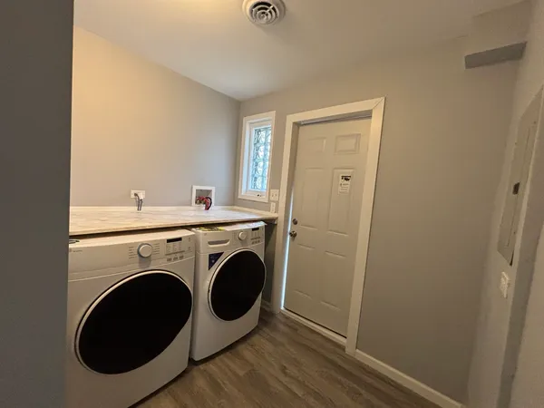 a view of livingroom with washer and dryer