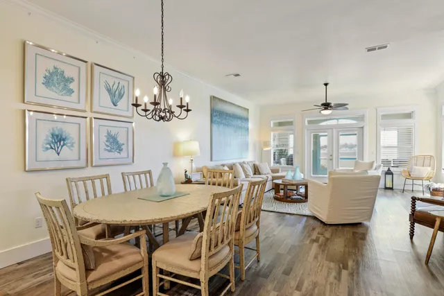 a view of a dining room with furniture wooden floor and chandelier