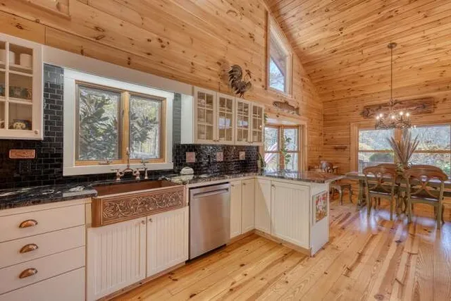 a bedroom with a bed next to a window