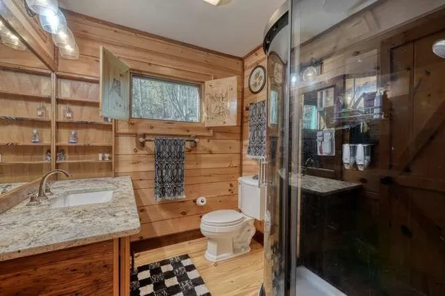 a bed room with a bed and a chandelier