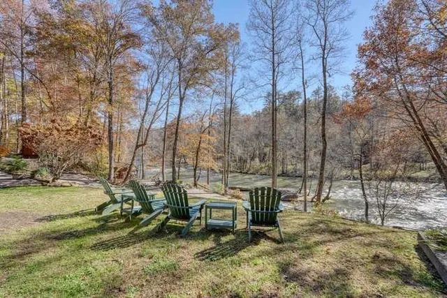 a bathroom with a toilet a sink and tub