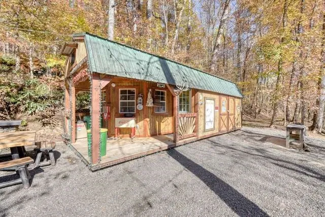 a backyard of a house with large trees