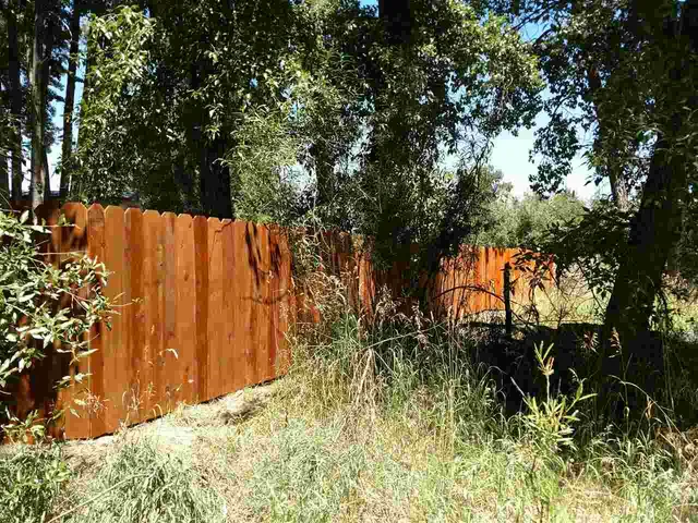 a view of a wooden fence