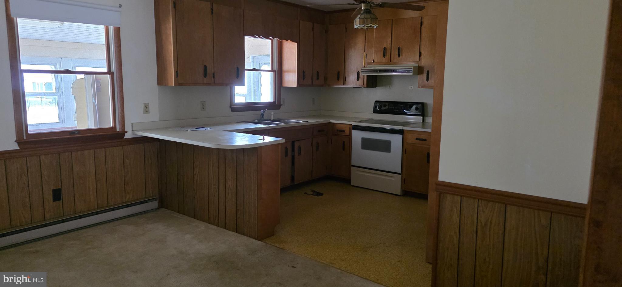 117 Howard Road Stevensville, MD 21666 - Photo 3 of 12 a kitchen with a sink and a stove