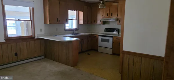 a kitchen with a sink and a stove