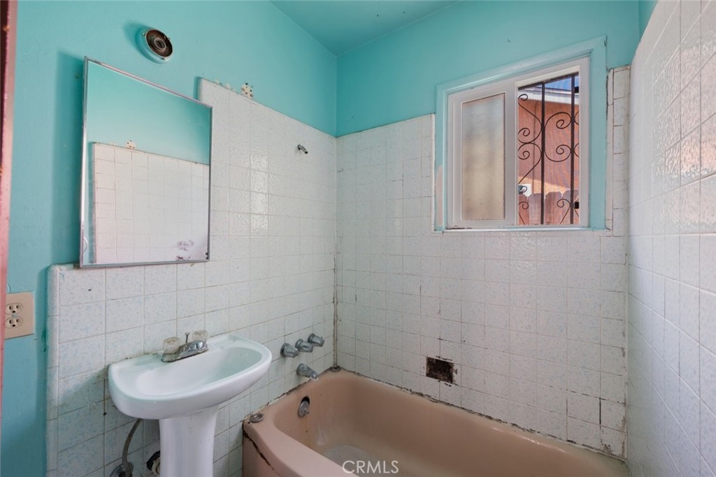 1618 Front Street Alhambra, CA 91803 - Photo 13 of 24 a bathroom with a sink mirror and toilet