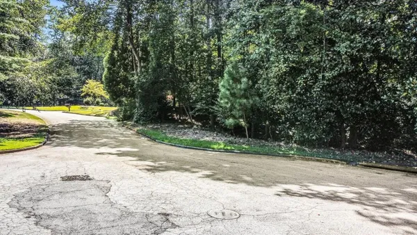a view of a swimming pool with a yard