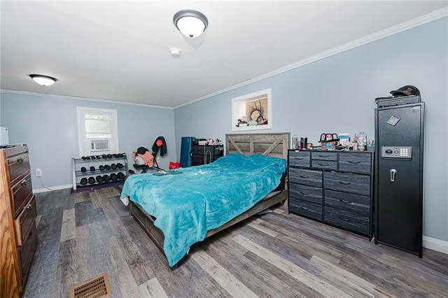 a bed room with a bed and dresser