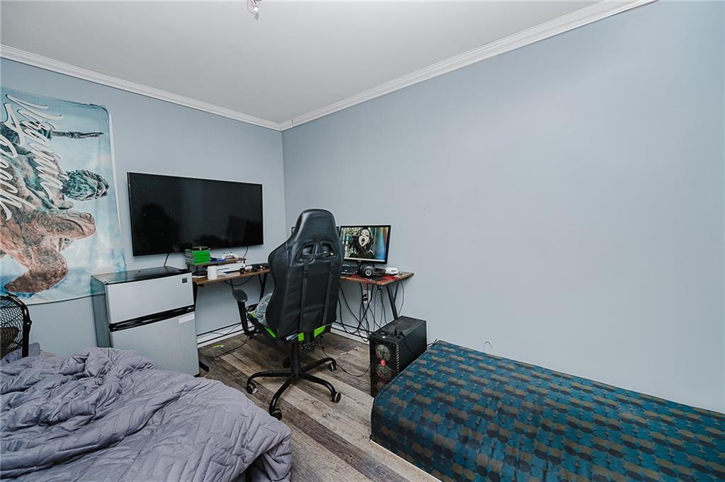 145 Baker Road Worthington, PA 16262 - Photo 21 of 50 a bedroom with a bed window and a flat screen tv