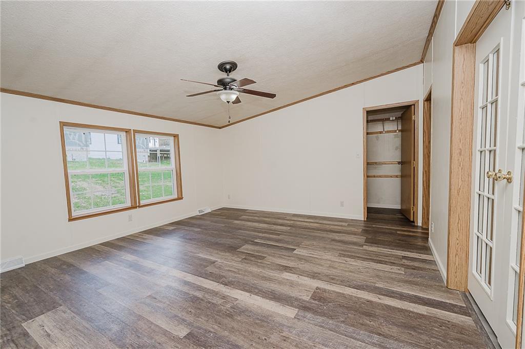 145 Baker Road Worthington, PA 16262 - Photo 24 of 50 a view of empty room with wooden floor and fan