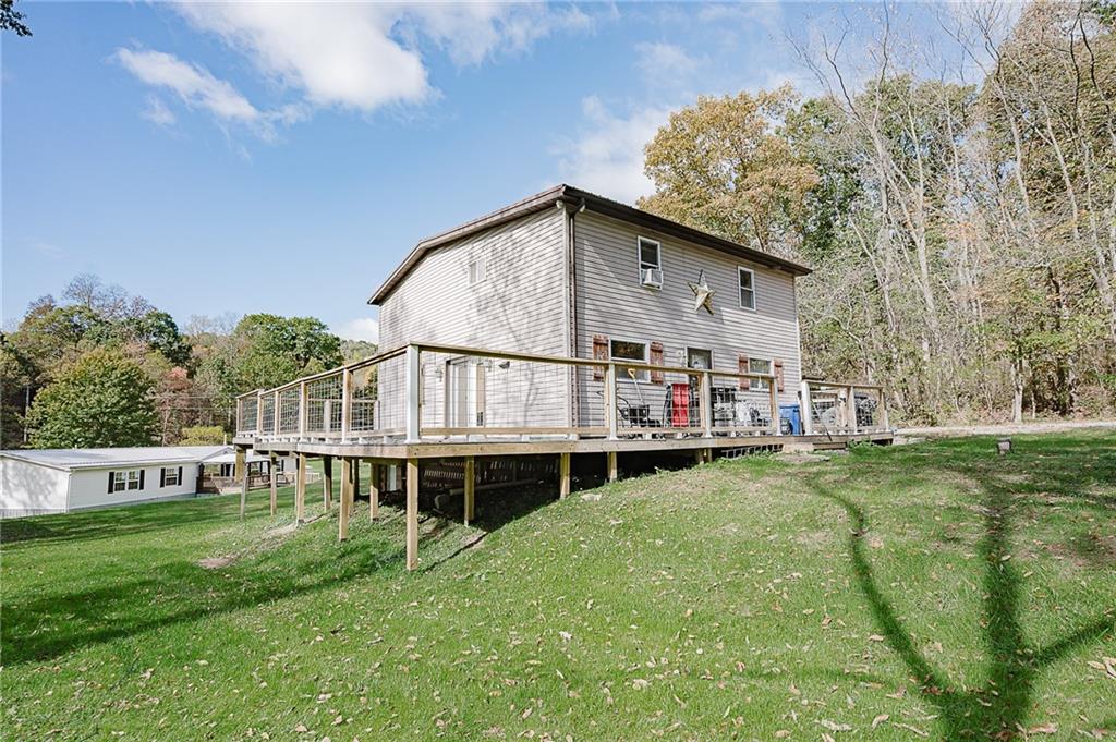 145 Baker Road Worthington, PA 16262 - Photo 3 of 50 a view of a house with a big yard and large trees