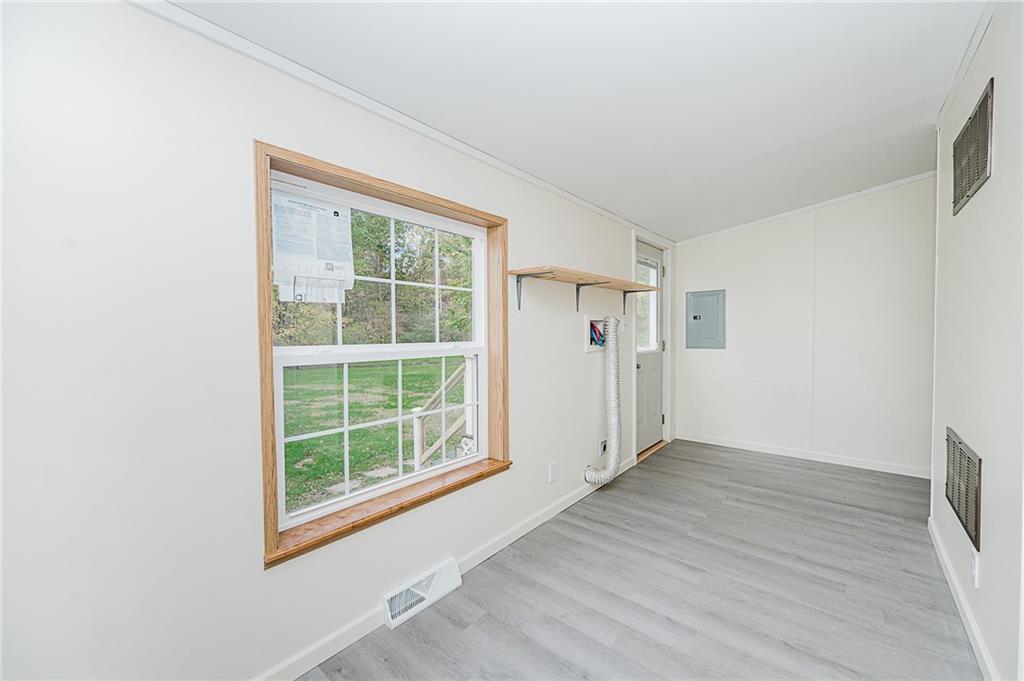 145 Baker Road Worthington, PA 16262 - Photo 31 of 50 an empty room with wooden floor and windows