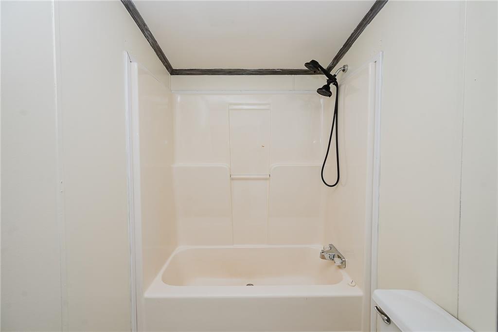 145 Baker Road Worthington, PA 16262 - Photo 37 of 50 a bathroom with a bath tub with a shower