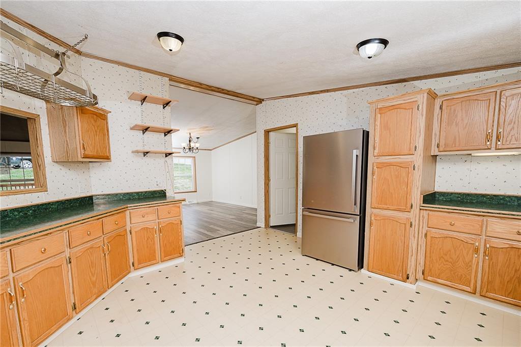 145 Baker Road Worthington, PA 16262 - Photo 49 of 50 a kitchen with granite countertop a refrigerator and a sink