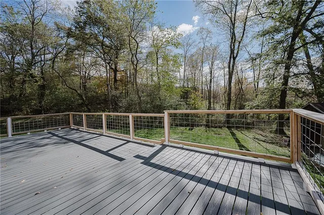a view of balcony with deck and wooden floor