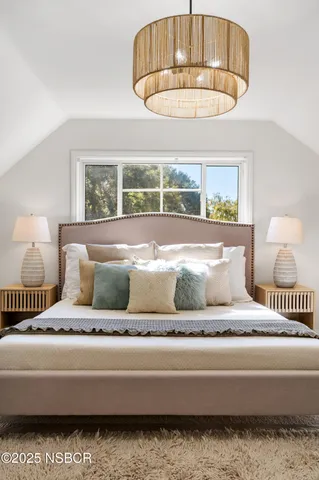 a view of a patio with couches potted plants and a palm tree