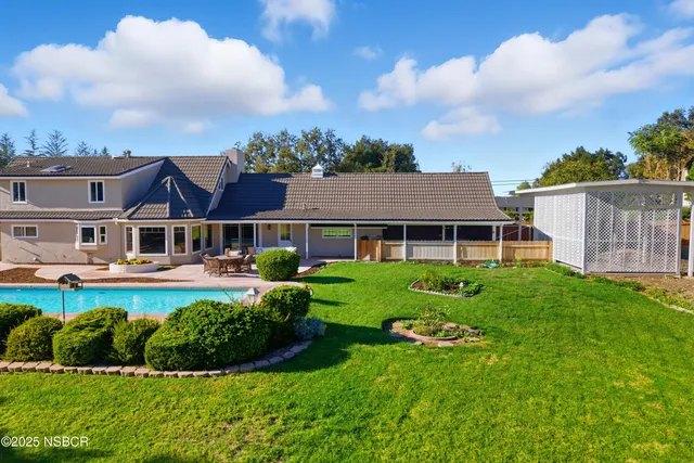 an aerial view of a city and mountain view in back