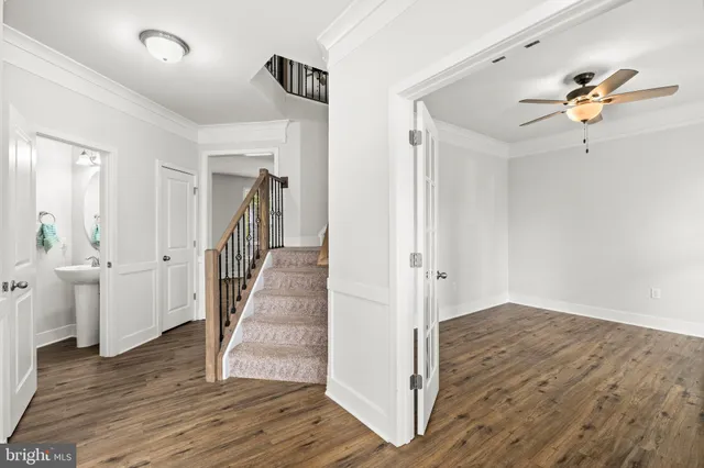 a bathroom with a tub a mirror and shower
