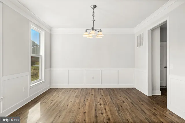 a kitchen with stainless steel appliances granite countertop a stove and a microwave