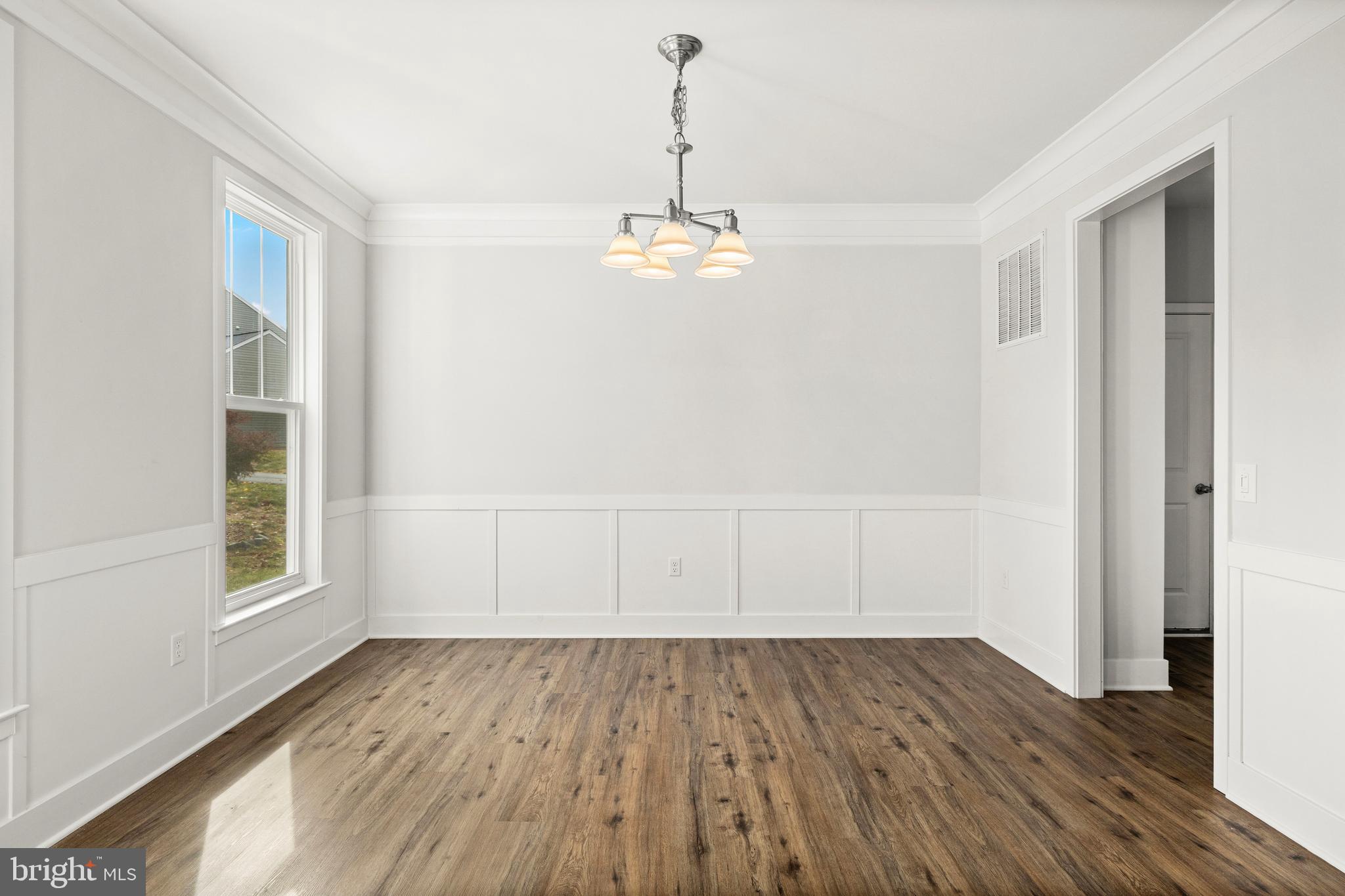 9113 Royal Court Partlow, VA 22534 - Photo 4 of 38 Dining room with wainscoting and crown molding