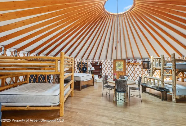 a balcony with furniture and wooden floor