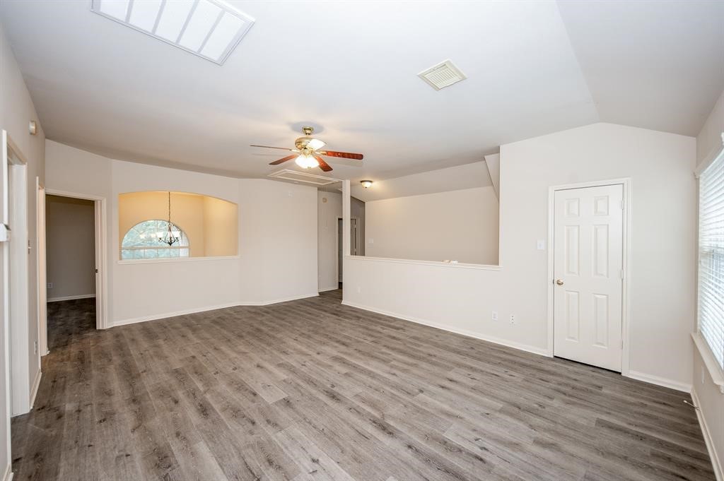 18914 Appletree Ridge Road Houston, TX 77084 - Photo 19 of 31 wooden floor in an empty room with a window