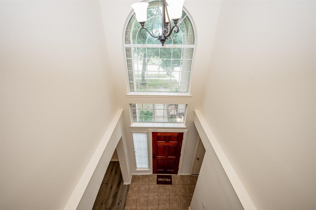 18914 Appletree Ridge Road Houston, TX 77084 - Photo 20 of 31 a view of an entryway with wooden floor and door