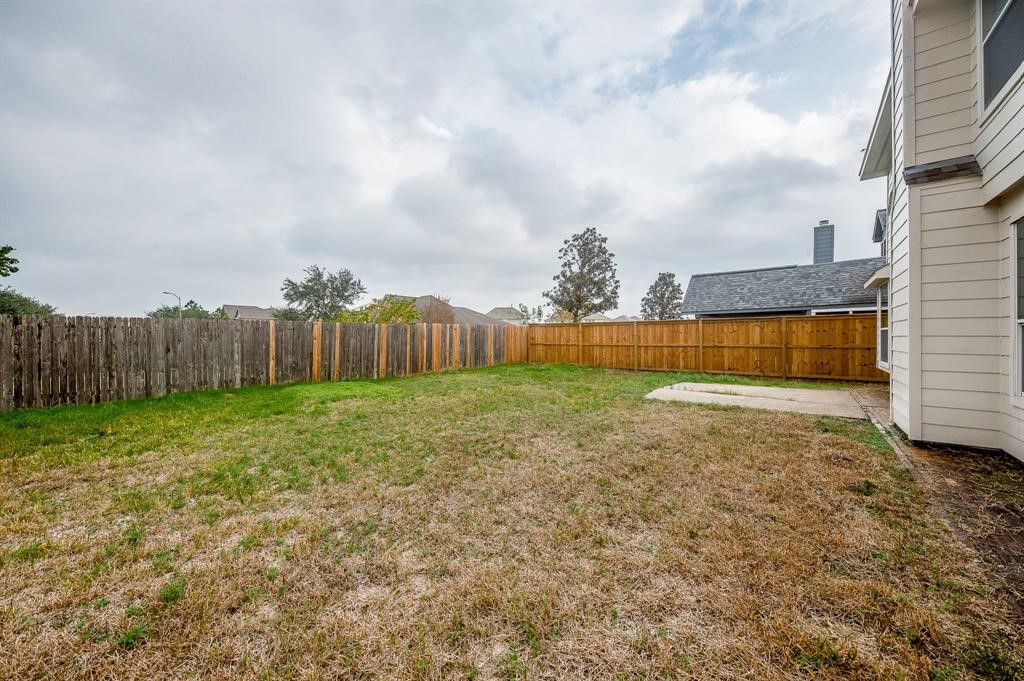 18914 Appletree Ridge Road Houston, TX 77084 - Photo 31 of 31 a view of backyard with wooden fence