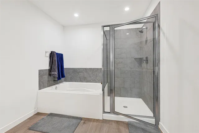 a spacious bedroom with a bed and window