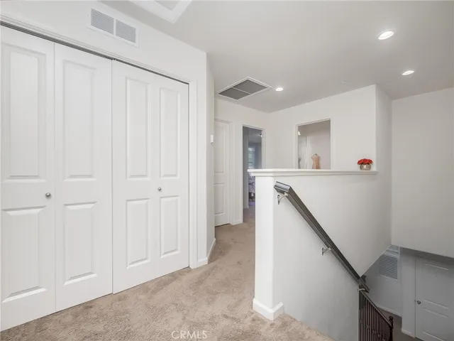 a storage room with cabinets washer and dryer