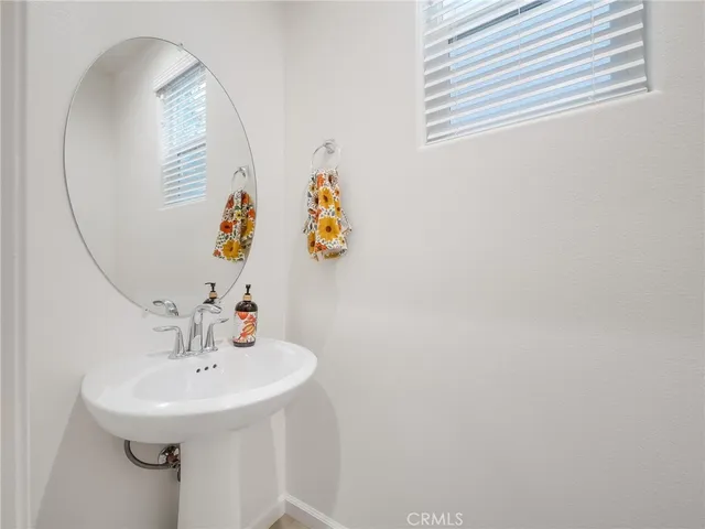 a bathroom with a sink and mirror