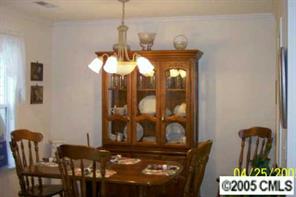 21245 Cold Spring Lane Cornelius, NC 28031 - Photo 2 of 8 a view of a dining room with furniture and chandelier