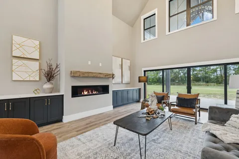 a kitchen with a sink cabinets and wooden floor