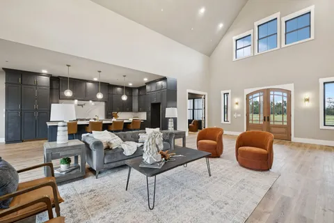 a kitchen with a sink a counter space appliances and cabinets