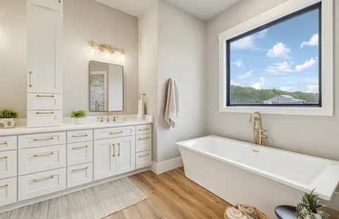 a bathroom with a sink a toilet and mirror