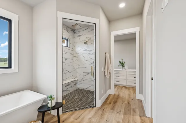 a view of an entryway with wooden floor