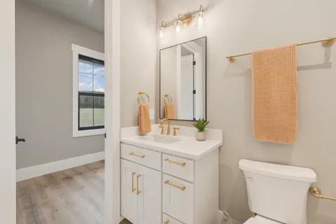 a view of a big house with a big yard and large trees