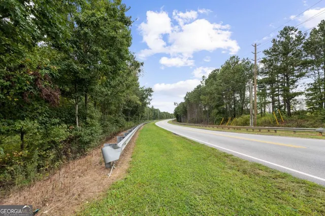 a view of a yard with a tree