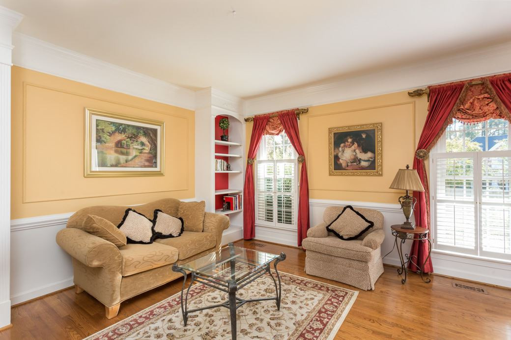5215 Coffee Tree Drive Raleigh, NC 27613 - Photo 14 of 25 Large front windows keep the living room bright and inviting. Living Room