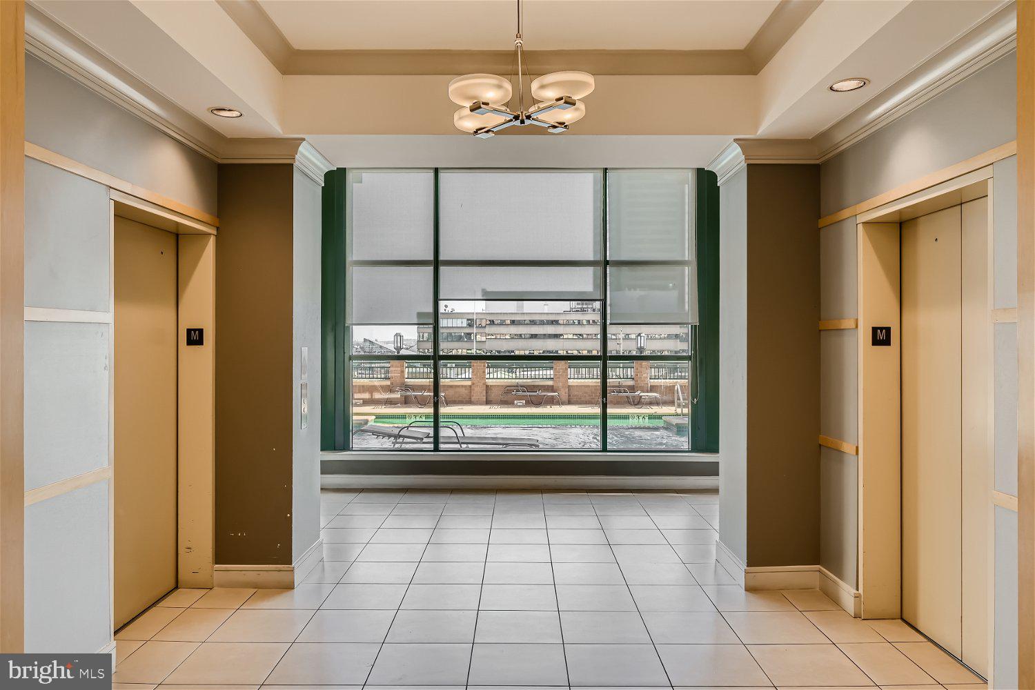 414 Water Street, Unit 2302 Baltimore, MD 21202 - Photo 21 of 34 a view of an empty room with a window