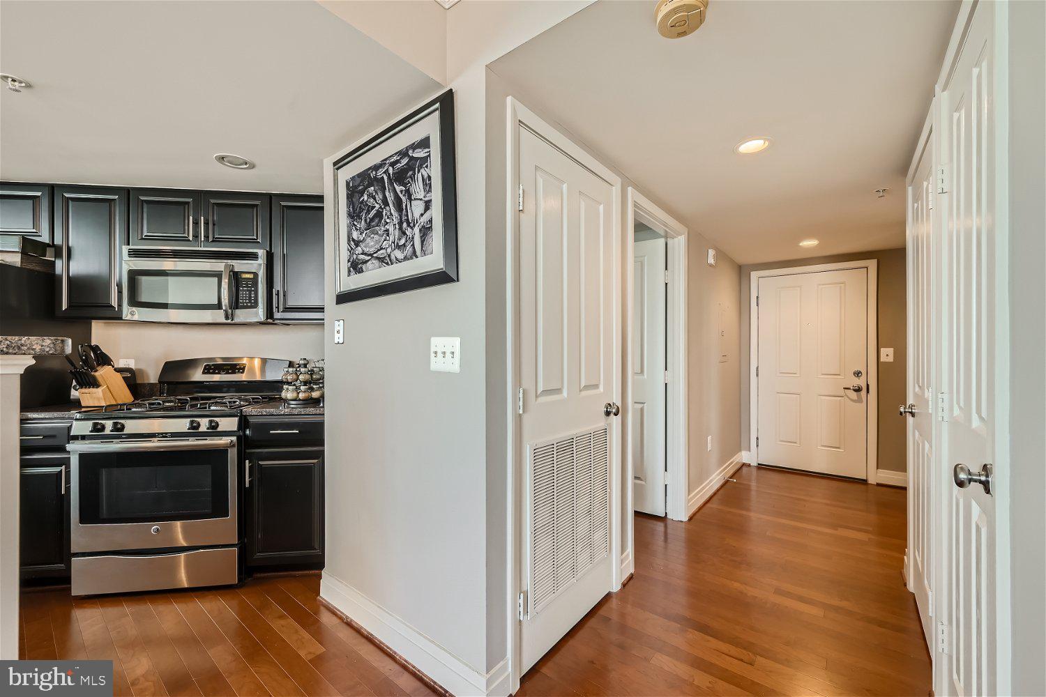414 Water Street, Unit 2302 Baltimore, MD 21202 - Photo 9 of 34 a view of kitchen with sink and stainless steel appliances