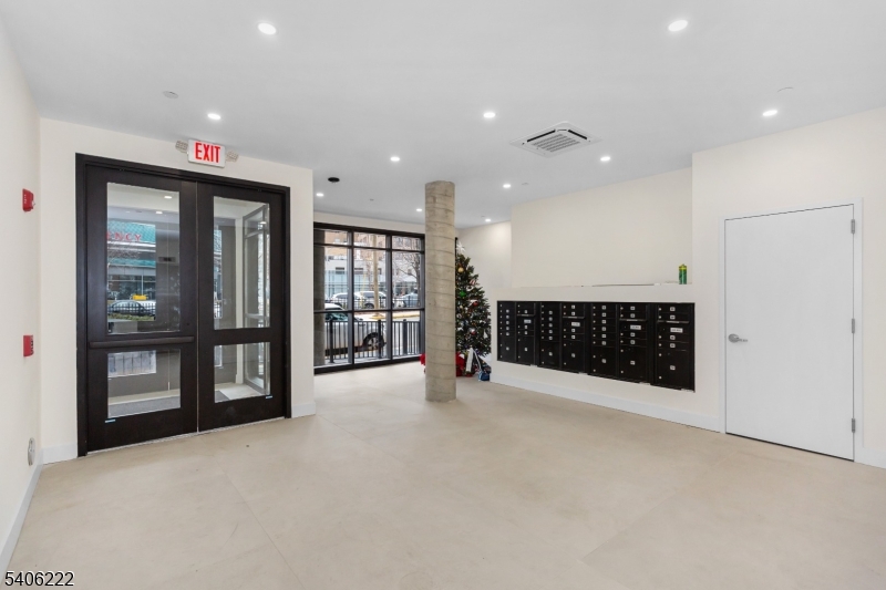87-89 Mary Street, Unit 503 Paterson, NJ 07503 - Photo 14 of 14 a view of an empty room with a window and fireplace